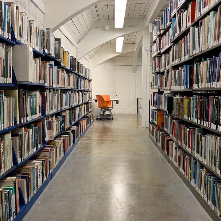 Hall of books in the corner of Collins Memorial Library at University of Puget Sound